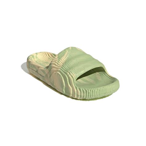 Get beach-ready with Adidas adilette 22 slides in vibrant lime and desert sand